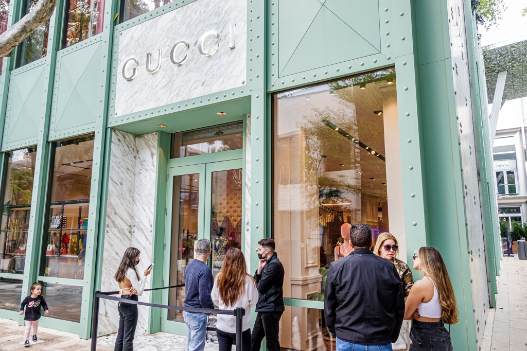 A Gucci store in Miami attracting a line of customers.