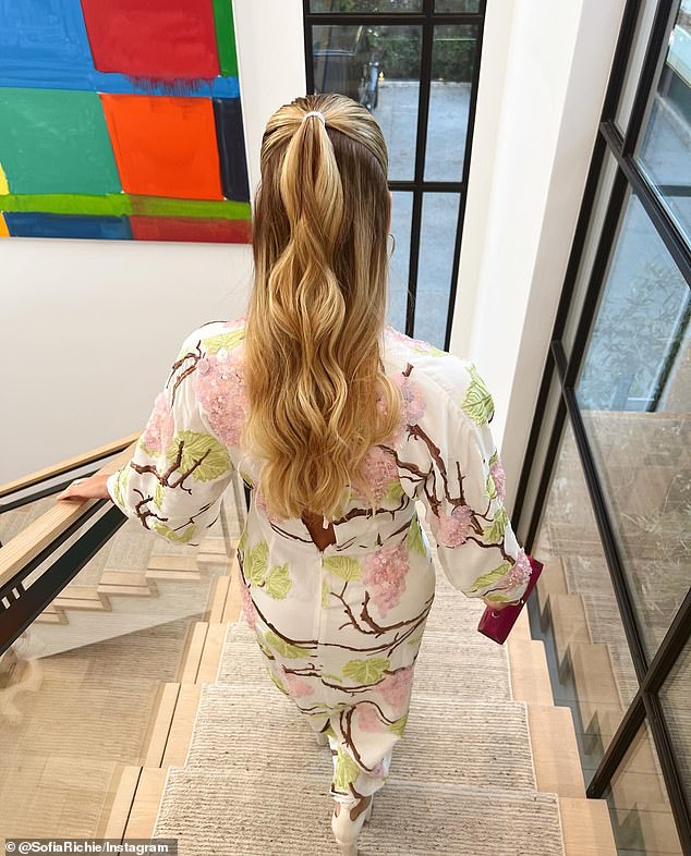 Her hair was spot on: There was a picture of the back of her hair walking down the stairs of a modern mansion
