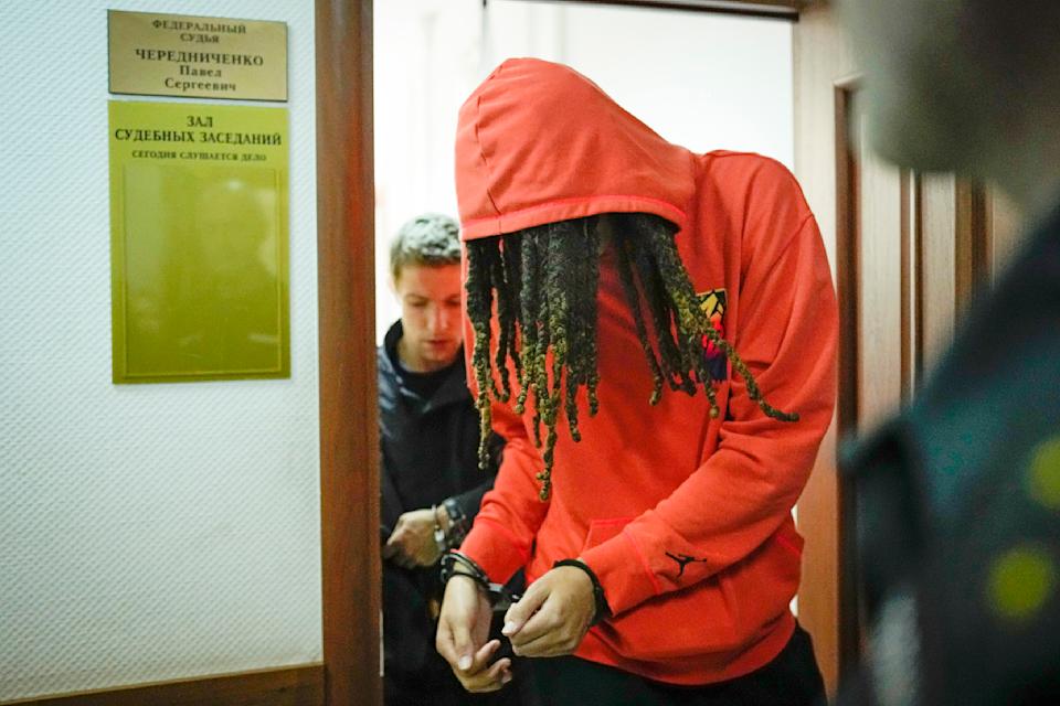 Brittney Griner leaves a courtroom on Friday, May 13, after a hearing outside Moscow.  Griner, a two-time Olympic gold medalist, was arrested at Moscow airport in February after e-cartridges containing cannabis oil were allegedly found in her luggage.  (AP)