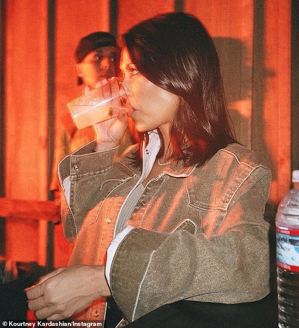 eyes for someone else?  Travis looks away in a flashback photo from 2018 that Kourtney recently posted