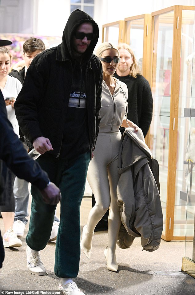 Chic: While Pete cut a casual figure in green sweatpants, he sported a black graphic tee that he wore underneath a black hoodie.