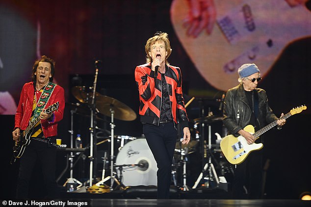 Rock stars: Meanwhile, Mick put on a stunning performance with the Rolling Stones as they performed in Liverpool for the first time since 1971 (LR Ronnie Wood, Mick Jagger, Keith Richards)