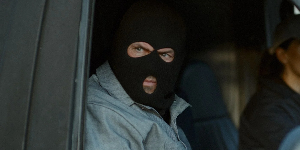 Randy Couture wears a ski mask in Blowback.