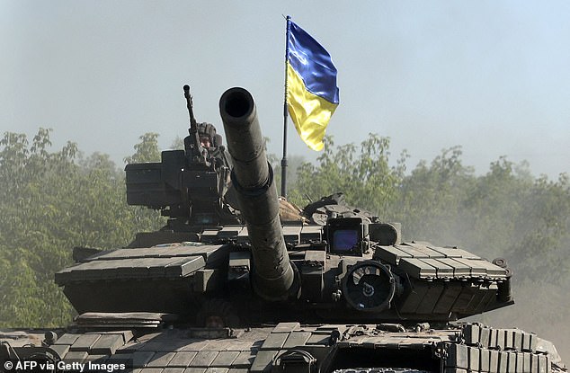 Ukrainian troops drive a tank on a road in eastern Ukraine's Donbass region on June 21, 2022, as Ukraine says Russian shelling caused it "catastrophic destruction" in the eastern industrial city of Lysychansk, which is directly across from Severodonetsk, where Russian and Ukrainian troops have been locked in combat for weeks