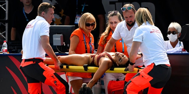 Anita Alvarez of the United States is carried on a stretcher after swimming during the solo free final of artistic swimming at the 19th FINA World Championships in Budapest, Hungary, Wednesday, March 22. 