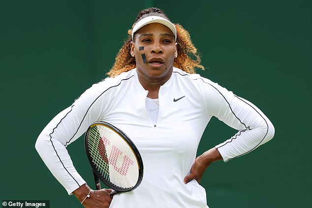 Practice: The American tennis ace, 40, also wore black tape across her face as she prepared to compete in the Wimbledon tennis tournament after winning a wild card entry in the women's singles
