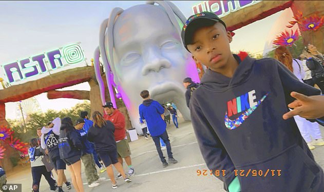 Ezra Blount, 9, poses in front of the Astroworld Festival entrance.  He was the youngest victim of the November 2021 tragedy