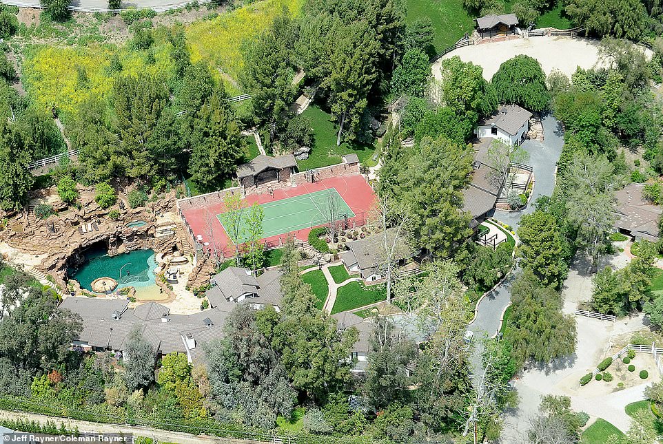 Pricy: Drake spent $7.7 million to buy the six-bedroom, eleven-bathroom home from Saddle Ranch owner Larry Pollack