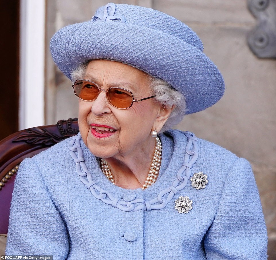 The video showed a royal assistant standing ready to help Her Majesty down the steps to the platform, but the monarch (pictured) descended the steps unaided