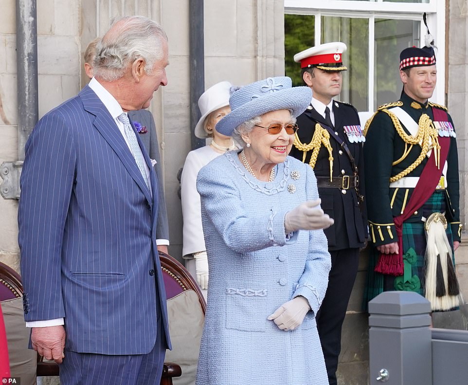The Prince of Wales, known in Scotland as the Duke of Rothesay, and the Queen stand side by side at today's event