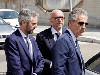 Haggis, co-writer, director and producer of Crash, which won the 2006 Oscars for Best Picture and Best Screenplay, is pictured with his lawyers in court in Italy