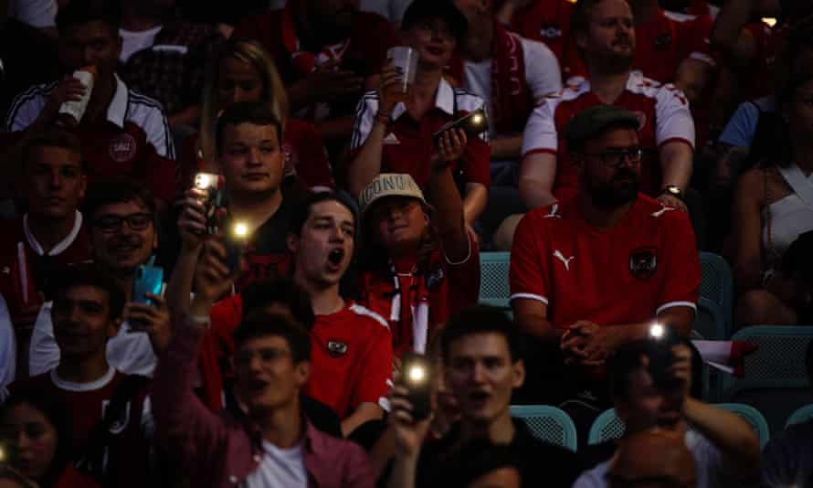Austria fans wait in the dark for the electricity to be restored.