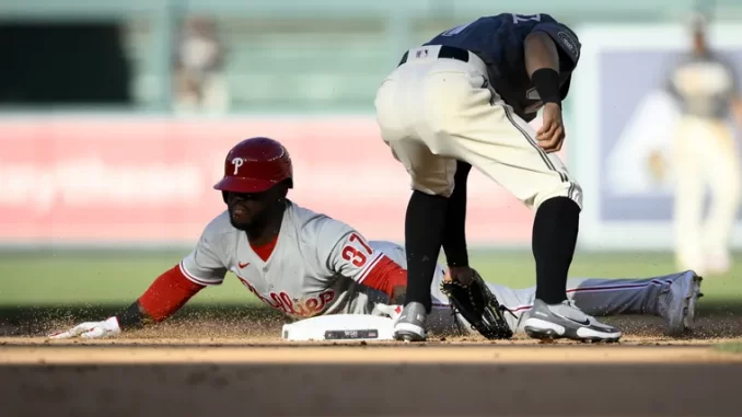 Odubel Herrera, left, steals second against Nationals second baseman Cesar Hernandez, right, during the sixth inning.