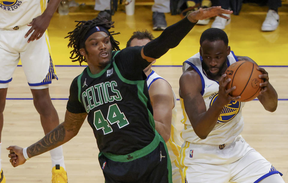 Boston Celtics center Robert Williams III defends Golden State Warriors forward Draymond Green during Game 5 of the 2022 NBA Finals at the Chase Center in San Francisco on June 13, 2022. (Matthew J. Lee/The Boston Globe via Getty Images)