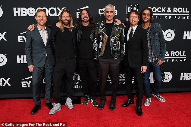 Tight group: The band members of the Foo Fighters were pictured together at the 36th Annual Rock & Roll Hall of Fame Induction Ceremony in 2021