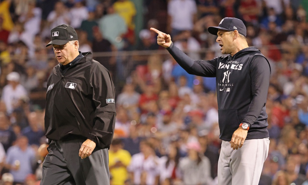 Aaron Boone argues with referee Jerry Layne.