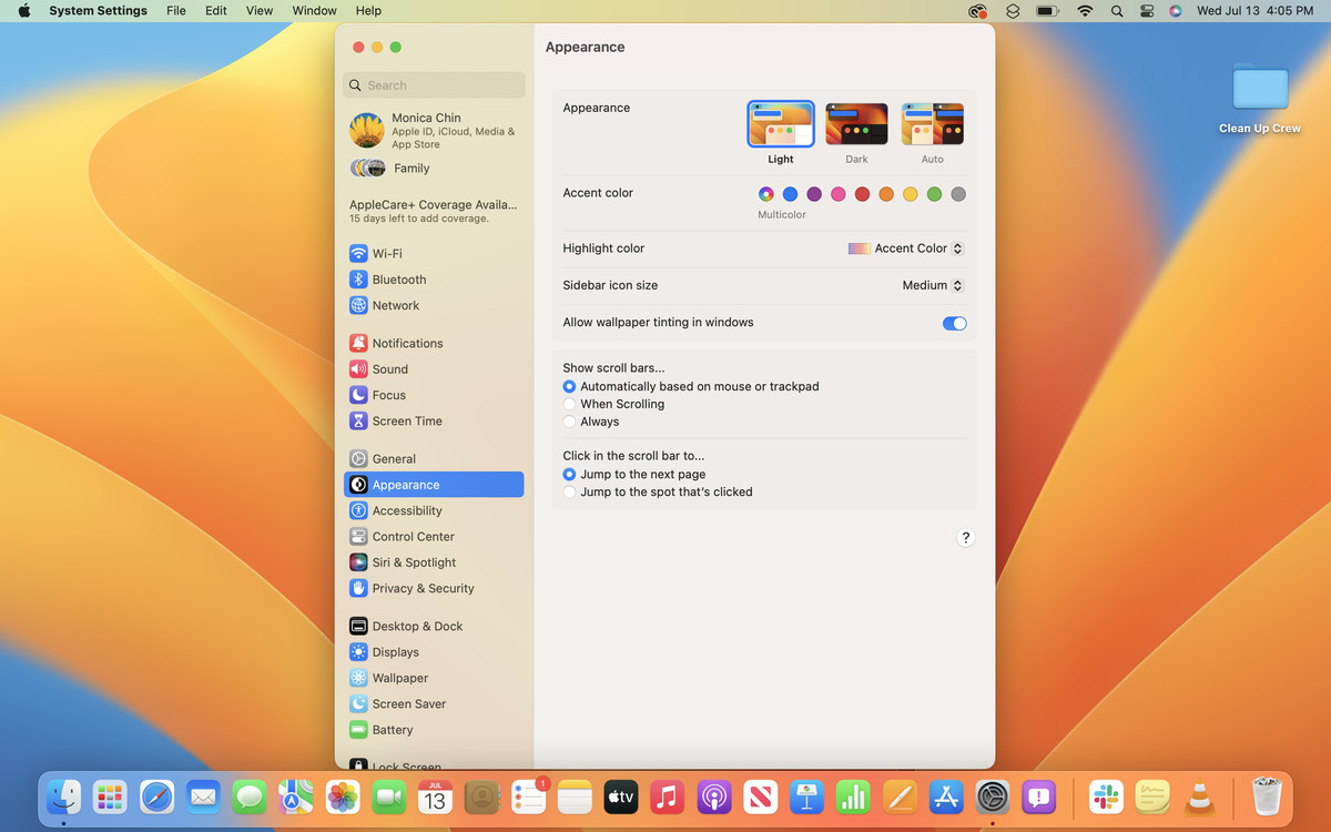 A screenshot of the System Preferences app open in macOS Ventura on a blue and orange desktop background.