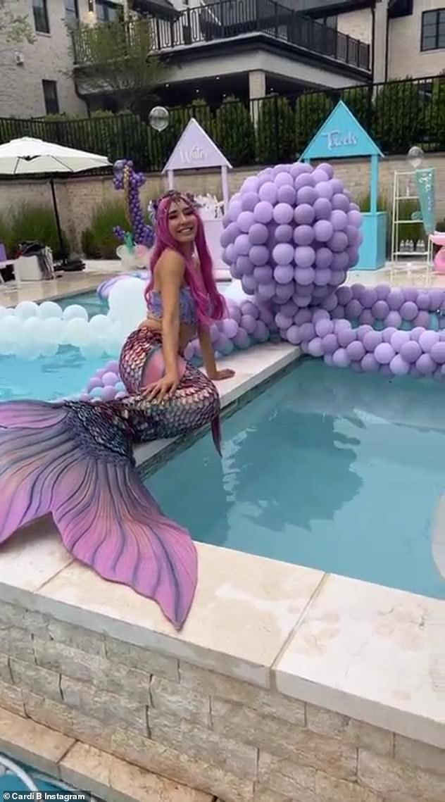 Decadent: A mermaid stretching out on the edge of the pool