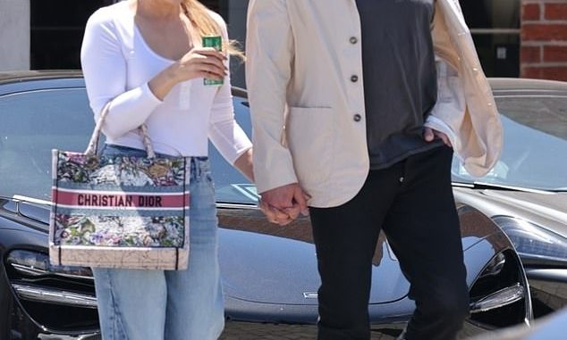 New ride: Ben Affleck, 49, and Jennifer Lopez cut cute, casual figures while browsing for luxury cars at a Beverly Hills dealership on Saturday