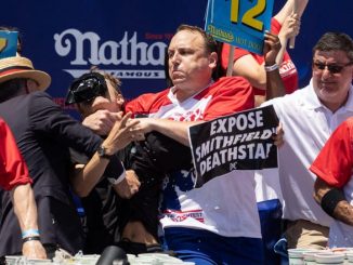 Joey Chestnut attacks a protester who disrupted the Nathan's hot dog eating contest.
