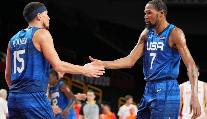 Devin Booker and Kevin Durant during a match against Spain at the Tokyo Olympics.