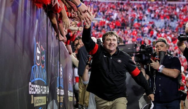 Georgia Bulldogs head coach Kirby Smart celebrates with fans after defeating Florida in the annual Florida vs Georgia soccer rivalry game at TIAA Bank in Jacksonville, Fla. on Saturday, November 2, 2019. [James Gilbert/Florida Times-Union] 