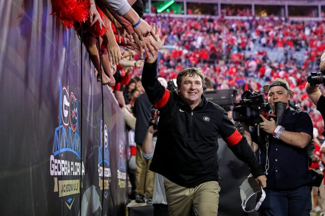 Georgia Bulldogs head coach Kirby Smart celebrates with fans after defeating Florida in the annual Florida vs Georgia soccer rivalry game at TIAA Bank in Jacksonville, Fla. on Saturday, November 2, 2019. [James Gilbert/Florida Times-Union] 