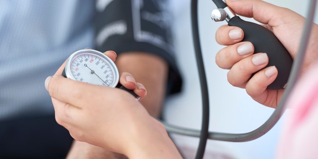 A nurse takes a patient's blood pressure. "A patient is at risk for high blood pressure, also known as hypertension, when systolic blood pressure readings are a constant 120-129, known as elevated blood pressure," said a health professional.