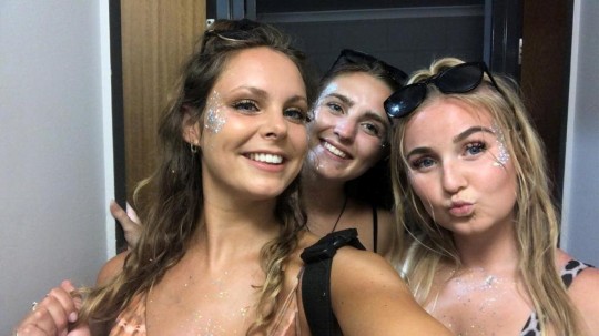 Laura Hawkins (left) with friends in Australia before her eye was injured