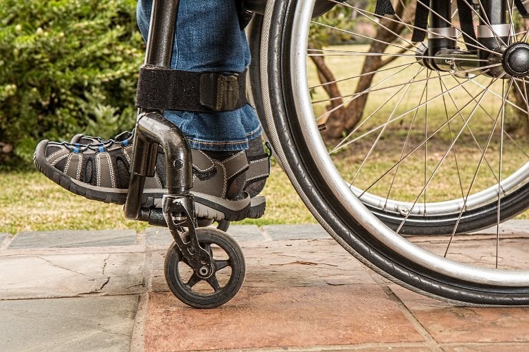 This shows the feet of a person in a wheelchair